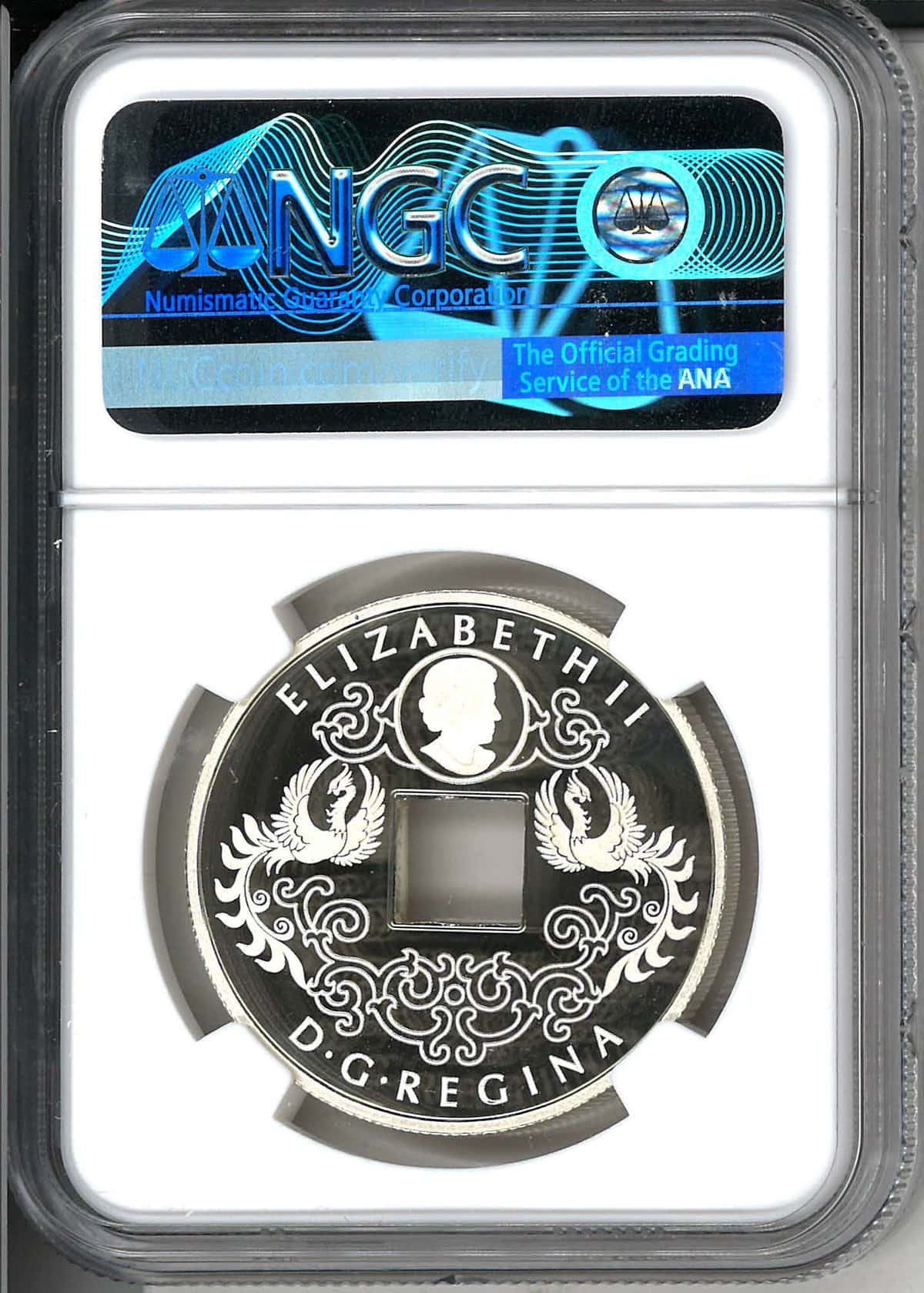 Silver coin featuring Queen Elizabeth II, ornate design with birds, and the inscription “D.G. REGINA”. Encased in protective holder with ANACS certification label.