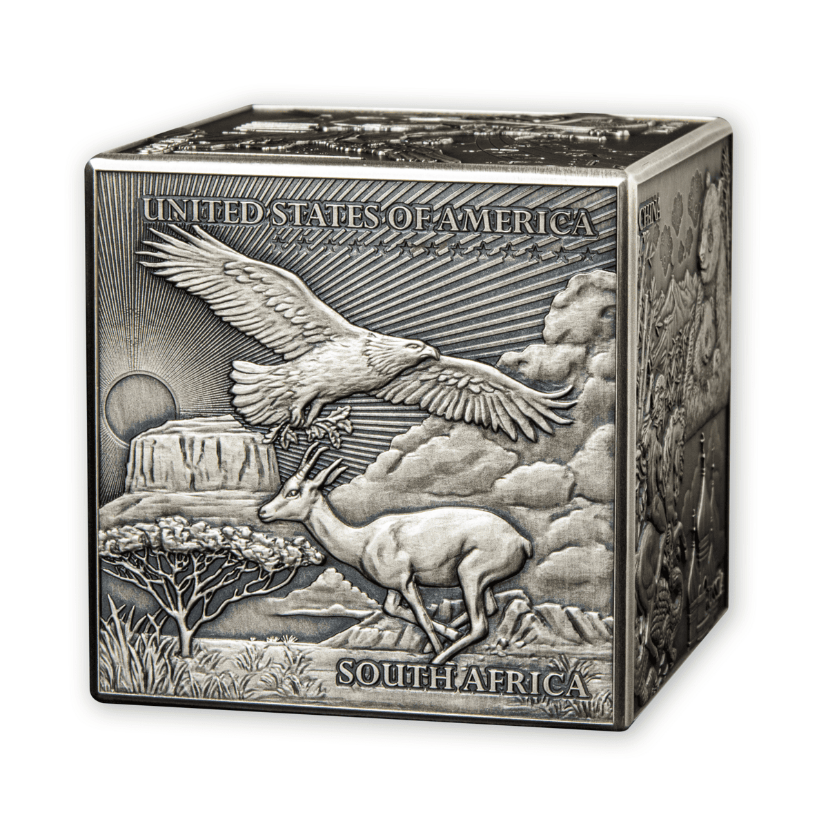 Silver South Africa 2023 collectible coin showcasing a soaring eagle and an antelope standing on a rocky landscape with mountains, clouds, and a rising sun in the background.