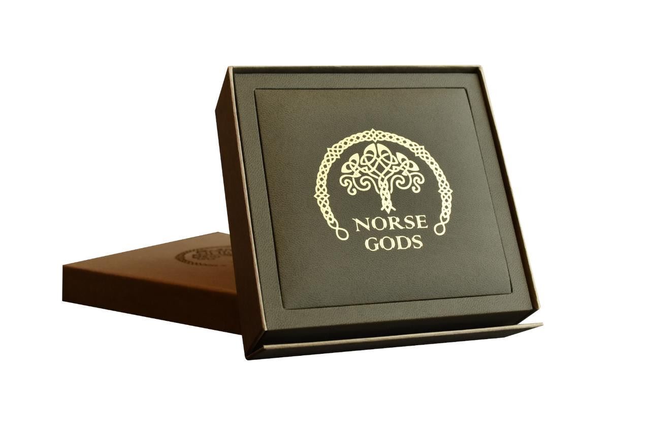 Norse Gods collectible coin in black presentation box with intricate Nordic design and gold foil branding.
