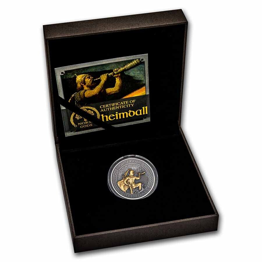 Heimall collectible coin with Certificate of Authenticity, featuring detailed design and historical imagery, presented in a black display box.