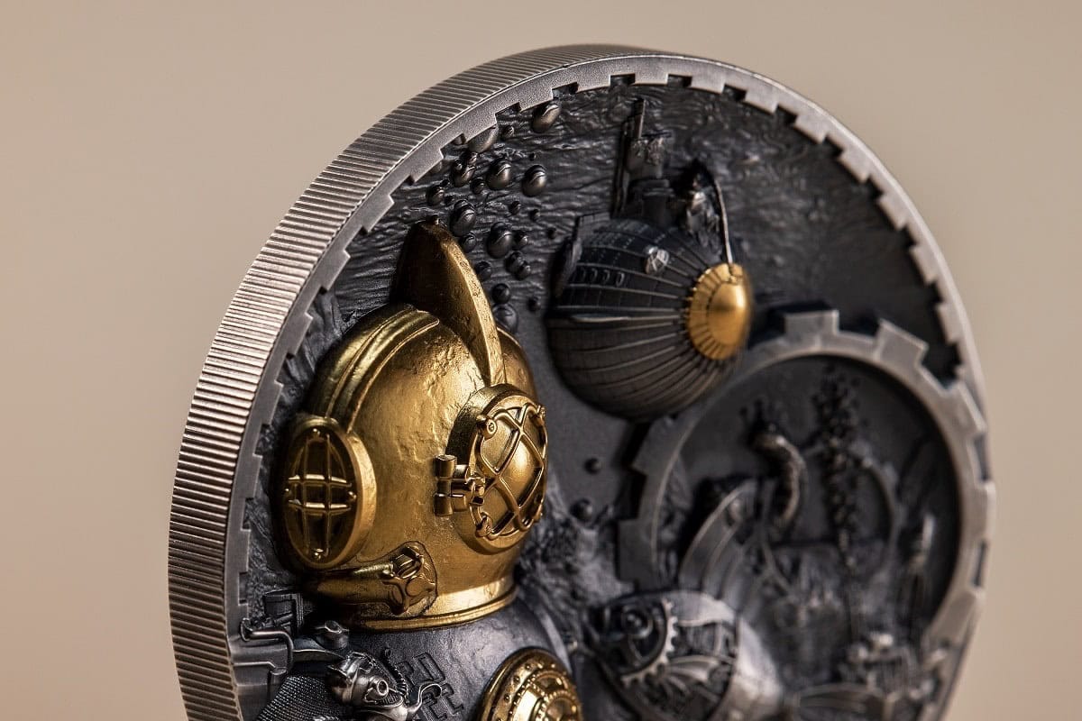 Intricate steampunk-style collectible coin featuring a gold and silver diving helmet with detailed mechanical elements and textured background.