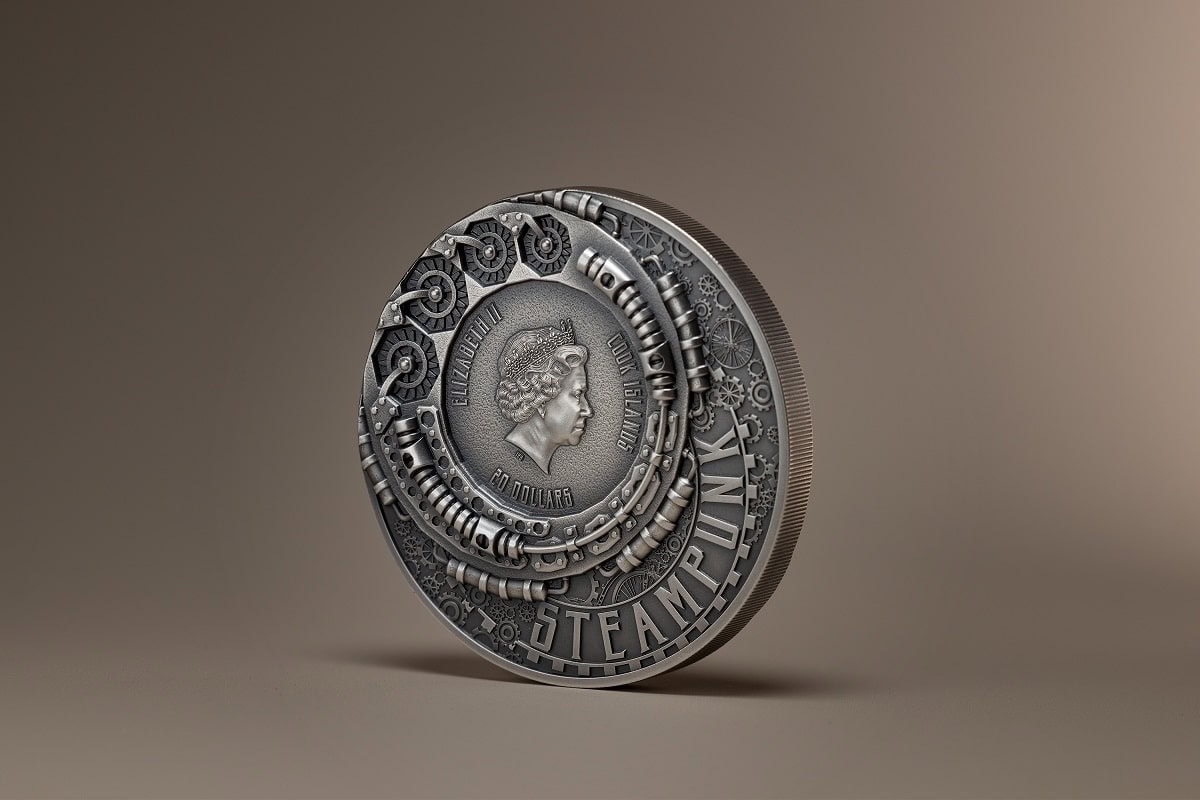 Intricate silver collectible coin featuring Queen Elizabeth II's profile, surrounded by detailed steampunk-inspired gears and machinery, valued at 100 dollars.