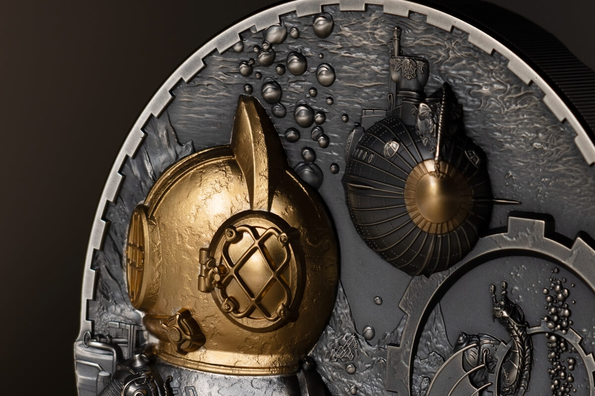 Golden 2023 commemorative coin with intricate deep-sea motifs, including a conch shell, diving helmet, and marine life, highlighting craftsmanship and maritime history.