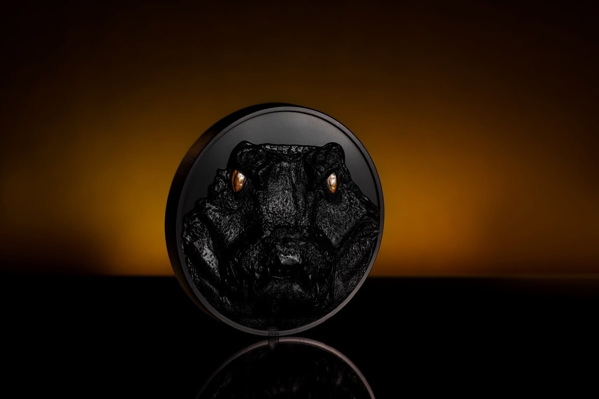 Black Panthar 2023 collectible coin with intricate tiger face design, detailed gold accents on the eyes, and a sleek black finish, representing strength and elegance.