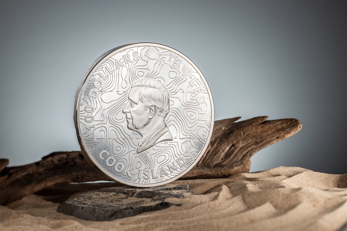 Highland Coin 2023, Cook Islands, silver collectible coin featuring a portrait of Sir Winston Churchill, with intricate engraved lines representing topography.