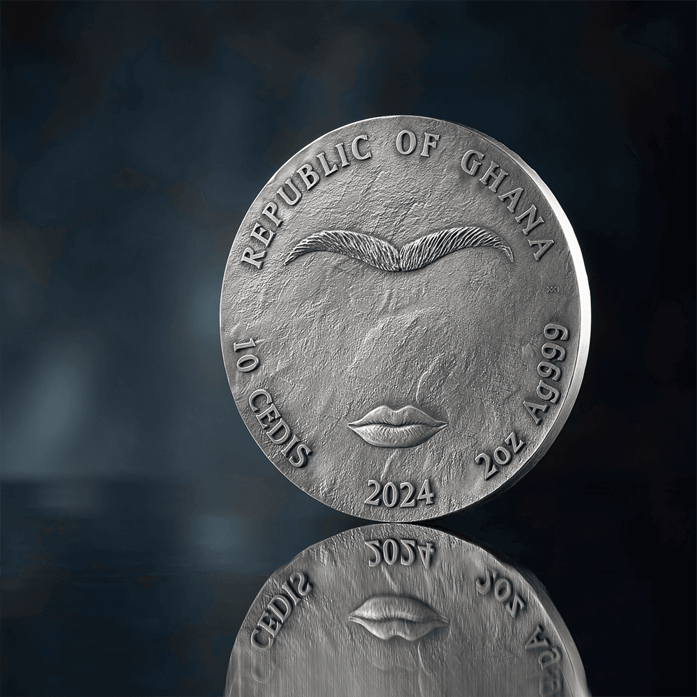 Vintage Ghanaian coin featuring a mustache and lips design, silver color, dated 2024, with denomination 10 cedis, and weight of 20 grams.