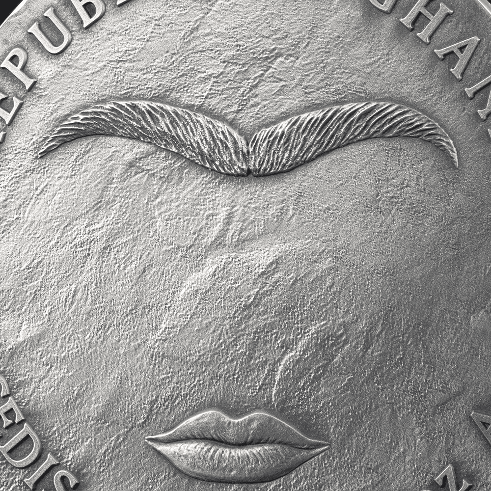 An intricate close-up of a silver coin featuring a stylized face with a mustache and lips, showing detailed engraving and textured background, ideal for collectors.