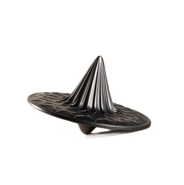 Metallic abstract sculpture with concentric rings and a conical top, modern design, placed on a reflective surface.