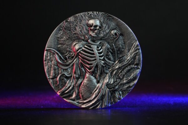 Skeleton holding a scythe coin, 2023, Mexico, silver collectible coin with detailed engraving and artistic design.