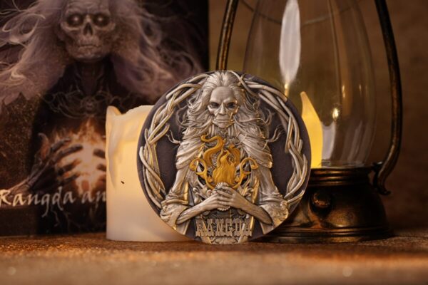 Decorative collectible coin featuring a detailed lion figure with a golden flame, surrounded by intricate engravings, and the word "RANGDA" on the bottom; inspired by fantasy art and mythology themes.