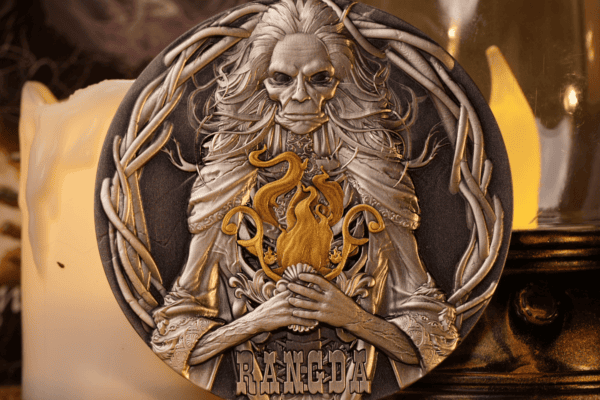 Rangda collectible coin featuring detailed relief of the demon queen with a fierce expression, holding a flaming torch, surrounded by intricate borders, with the year and country inscriptions visible.