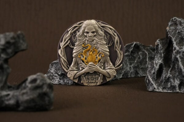 Intricate collectible coin featuring a detailed portrait of a wise figure with flowing hair, holding a golden dragon, surrounded by a circular frame with mountain-like rocks in the background.