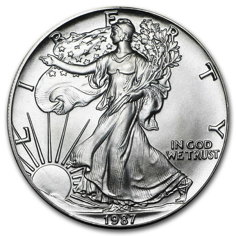 Front view of a 1987 American Silver Eagle 1 ounce brilliant uncirculated coin, featuring Lady Liberty walking with the sun behind her.