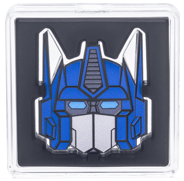 Intricate Transformers Optimus Prime collectible coin with blue, silver, and black accents, crafted with a geometric design; encased in a display case, perfect for fans and collectors.