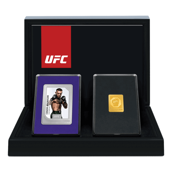 UFC collectible coin set featuring Conor McGregor, 2024 edition, with commemorative gold and silver coins, encased in a display box, celebrating UFC history and champion fighters.