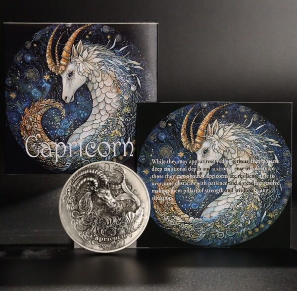 Elegant Capricorn zodiac coin featuring intricate artwork of a ram with swirling cosmic background, emphasizing astrological symbolism and celestial design elements.