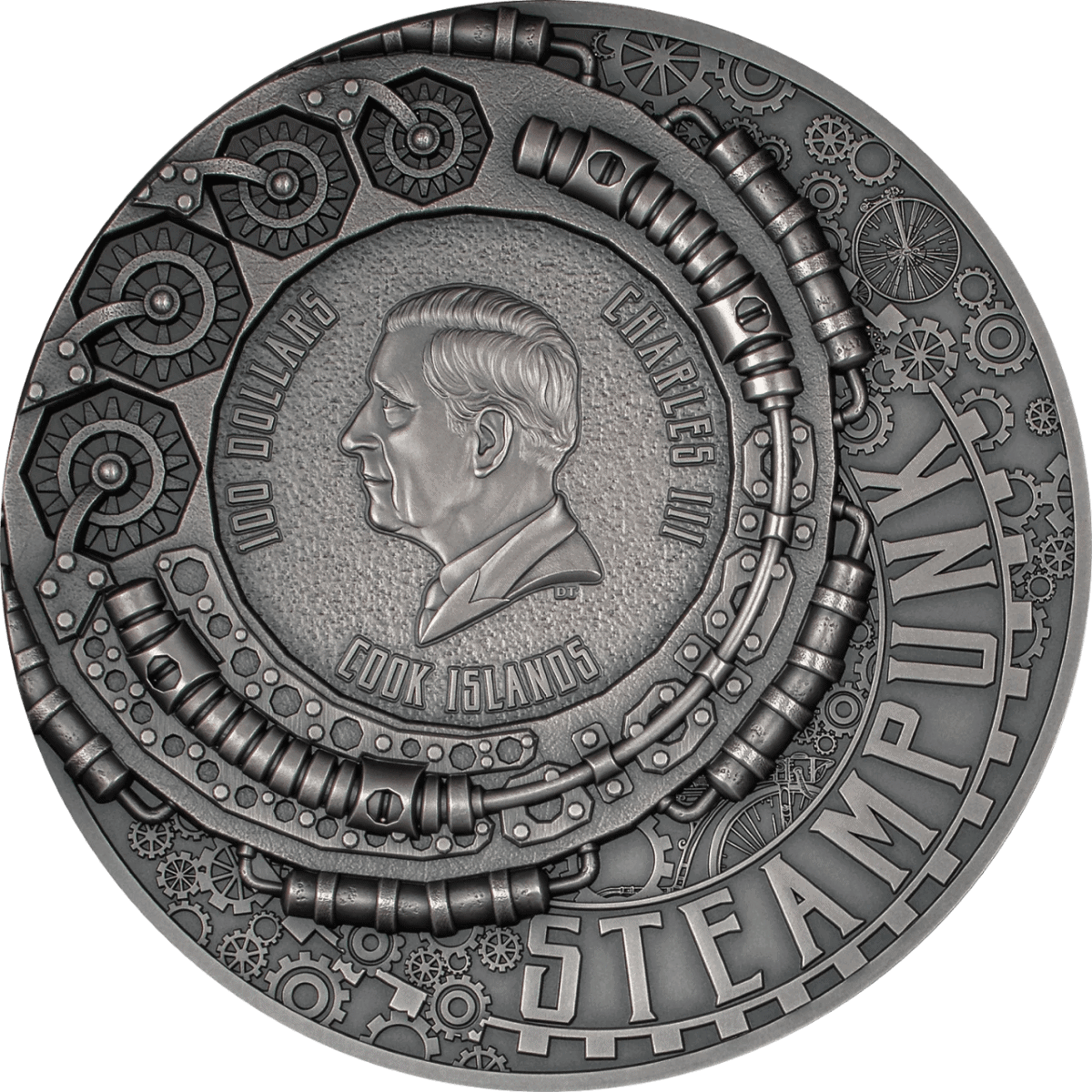 100 DOLLARS CHARLES III COOK ISLANDS 2023. Actual coin from the Cook Islands featuring a modern, industrial-inspired design with gear and machinery motifs. Sleek, metallic finish.