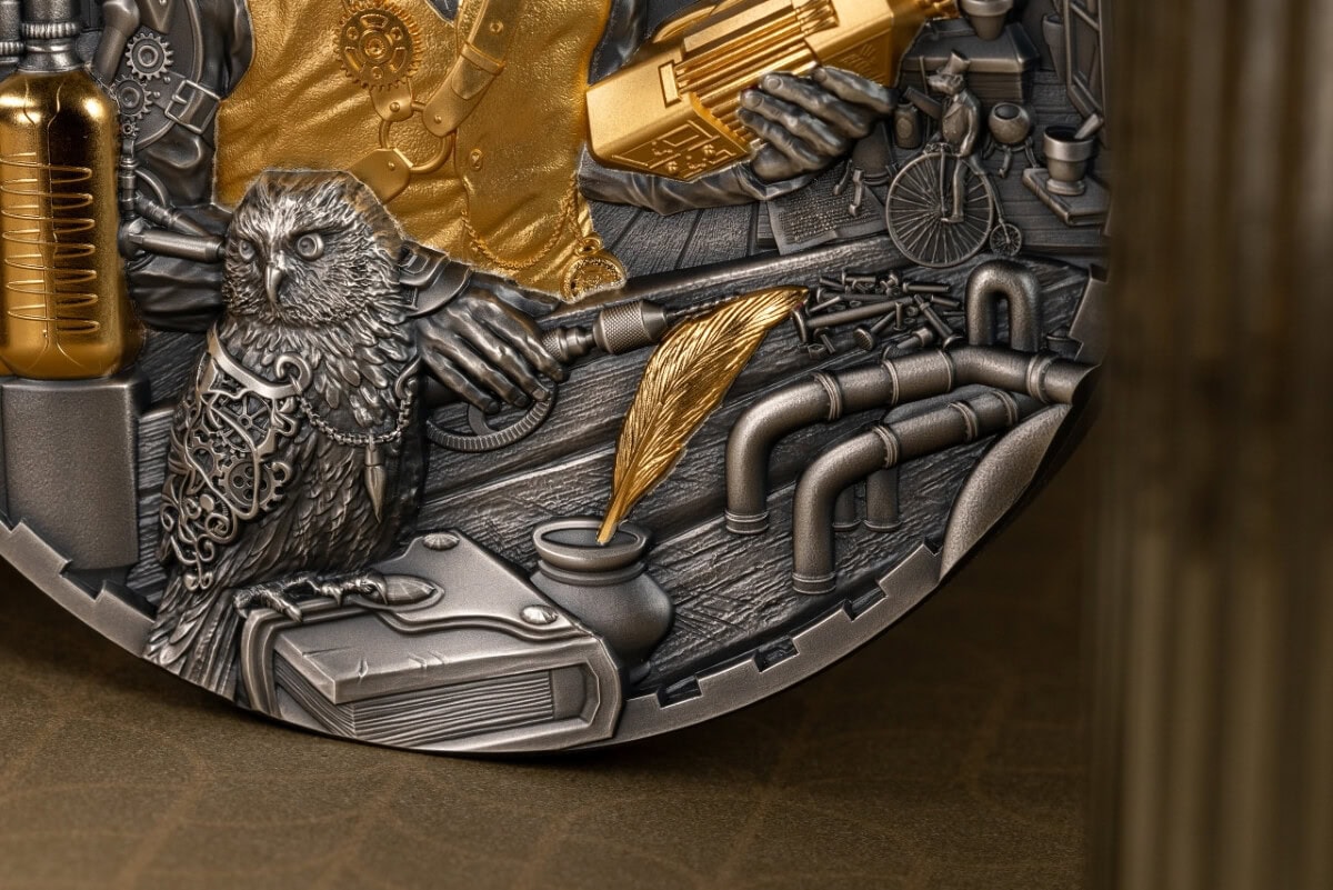 Innovative metallic collectible coin with detailed eagle design, pipes, and tools, featuring gold and gunmetal finishes, showcasing craftsmanship and unique artwork for collectors.