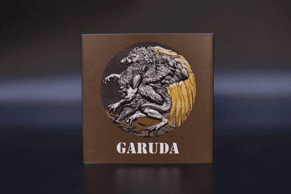 Majestic Garuda coin showcasing a detailed depiction of the legendary bird with intricate feather detailing, positioned on a square brown background.