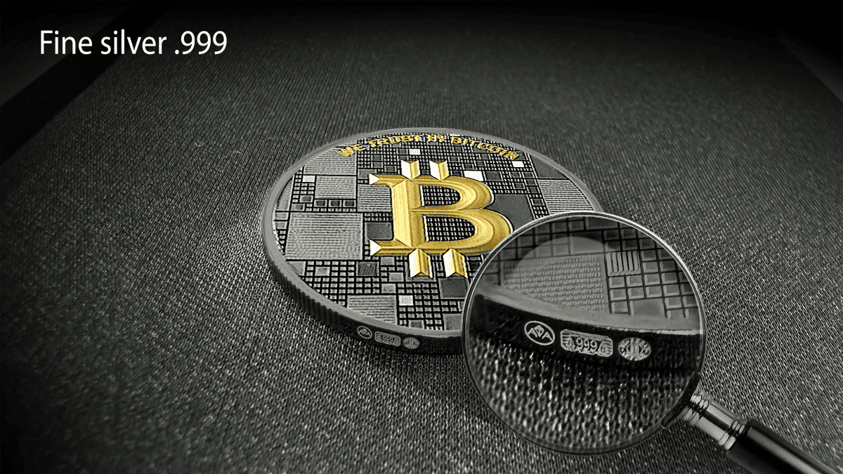 Golden Bitcoin logo on silver coin with detailed circuitry design, magnified section showing metal purity markings.