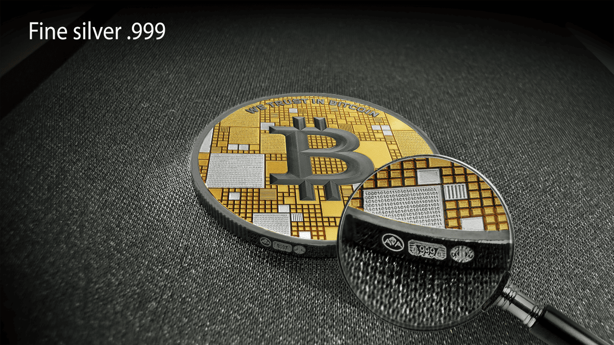 Gold bitcoin coin with detailed circuitry, magnified under a glass, showcasing precious metal markings and intricate design.
