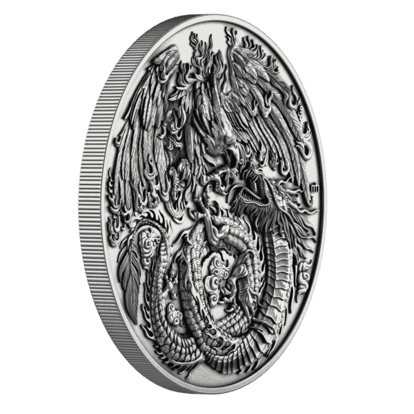 Side view of the 2025 Niue Phoenix and Dragon 2 oz Silver Coin showcasing ultra high-relief sculpting with elevated phoenix wings and dragon coils rising boldly from the coin’s shaped edge.
