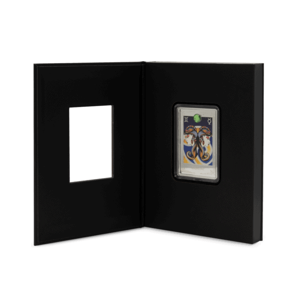 Vintage collectible coin featuring dual portrait design and astrological symbols, set in an elegant display case.