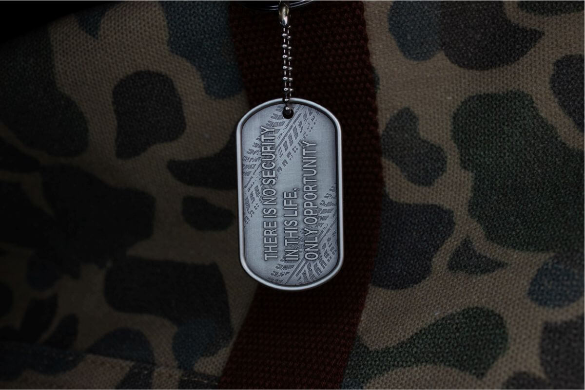 Dog-tag-with-engraving-2023-ukraine-ministry-of-defense-camouflage-background.jpg.