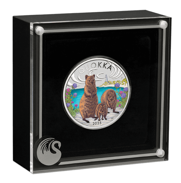 Display packaging for the 2025 Australia Quokka 1 oz Silver Colorized Coin featuring the coin positioned within a black case with transparent lid; coin shows a quokka and floral background with “QUOKKA” and “2025” inscriptions; swan logo appears in corner of case.