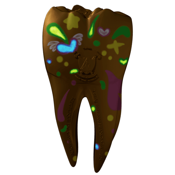 Glowing obverse of the 2025 Cameroon Tooth Fairy 2 oz silver coin under UV light, featuring the Republic of Cameroon seal, denomination, and magical fairy-themed engravings illuminated with hidden UV elements.