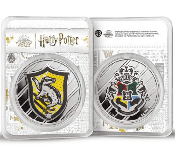Two 2025 Harry Potter 1 oz Silver Colorized Coins in TEP packaging side by side—left features Hufflepuff crest with badger and yellow detailing; right shows Hogwarts crest with all four house symbols on a silver-and-gold background.