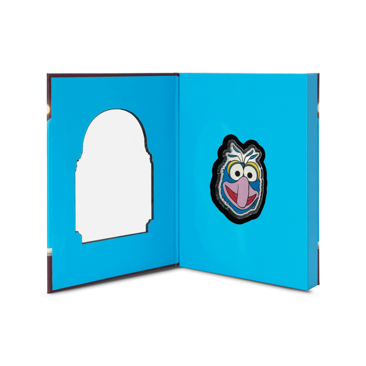 Gold and silver collectible coin featuring Sesame Street character, Count von Count, from 2023, with intricate detailing and vibrant colors.