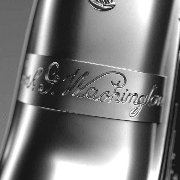 Zoomed-in detail of the 2025 Samoa George Washington’s Flintlock Pistol 2 oz Silver 3D Shaped Coin highlighting engraved barrel scrollwork, textured grip, and antique silver finish.
