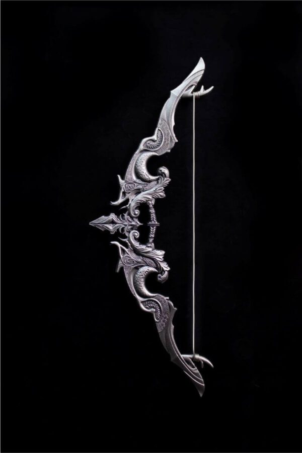 Front-facing image of the 2025 South Korea Divine Weapons Crescent Bow 2 oz Silver Antiqued Bar displayed on a black background with intricate mythological engravings.