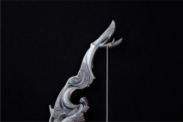 Close-up of the 2025 South Korea Divine Weapons Crescent Bow 2 oz Silver Antiqued Bar highlighting the sculpted string of the celestial bow.