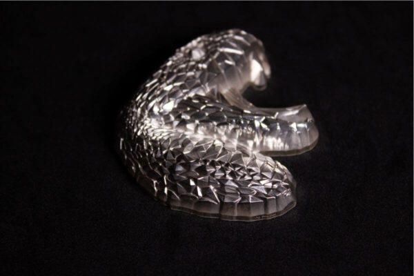 Side profile of the 2025 South Korea Lowpoly Lunar Snake 2 oz Silver Antiqued Stacker featuring angular contours and layered relief.