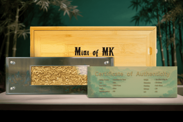 Full packaging set of the 2024 Chad “A Thousand Li of Rivers and Mountains” Coin including engraved wooden box with “Mint of MK” branding, transparent display holding landscape-format coin, and a green certificate of authenticity presented on a textured green surface.