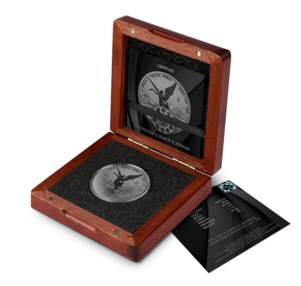 Open wooden display box showing the 2024 Mexico Libertad Ruthenium Black Platinum 1 oz Silver Colorized Coin against black interior lining; coin displays Winged Victory with dark-plated finish and silver relief; adjacent certificate card confirms specifications and authenticity.