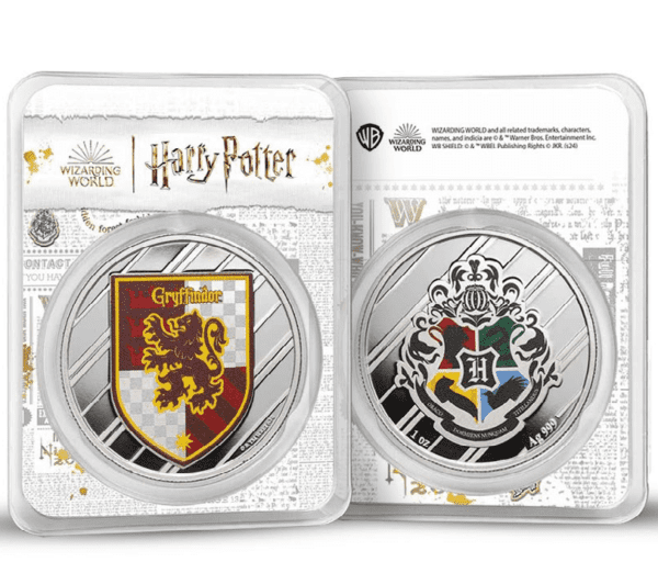 Front-facing view of two 2025 Harry Potter 1 oz Silver Colorized Coins in TEP packaging—left shows Gryffindor crest with red-and-gold lion emblem, right features Hogwarts crest with all four house animals and central “H” badge; both housed in clear cases with Harry Potter branding.