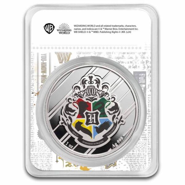 Back view of the 2025 Harry Potter Gryffindor 1 oz Silver Colorized Coin in tamper-evident packaging, showing King Charles III effigy on the reverse of the coin along with weight, purity, and denomination details; official licensing and product text printed on the insert behind the coin.