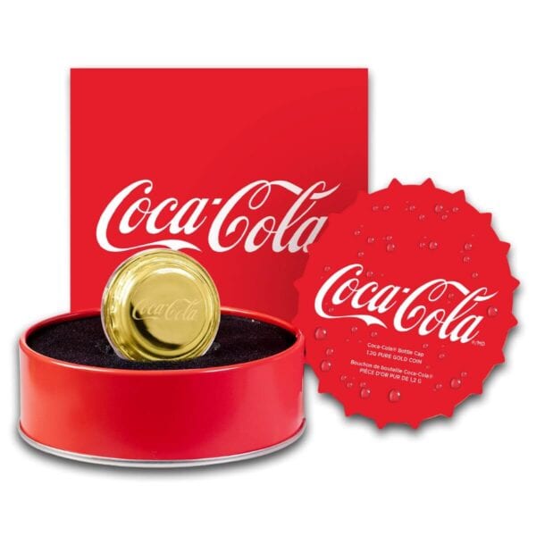 Full packaging display of the 2025 Niue Coca-Cola Bottle Cap 1.2 Gram Gold Shaped Coin featuring red box with Coca-Cola logo, gold bottle cap–shaped coin in circular capsule, and red branded card; coin rests in black interior.