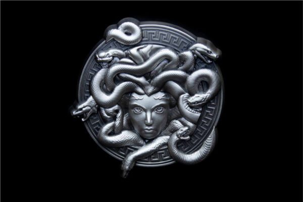Studio image of the 2025 South Korean Serpent Crown Medusa 2 oz Silver Antiqued High Relief Stacker reverse side featuring anguished face of Medusa with mouth agape, surrounded by outward-radiating snakes forming an ornate crown; high-relief detail and antiqued silver finish shown on black background.