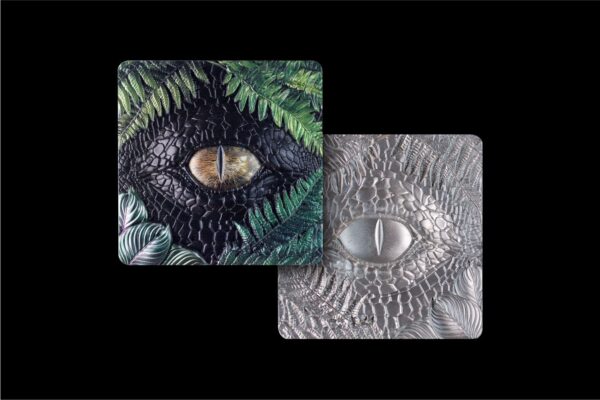 Front and back of 2025 South Korean The Watcher 2 oz silver stacker showing golden reptilian eye and sculpted reverse in antiqued high relief.