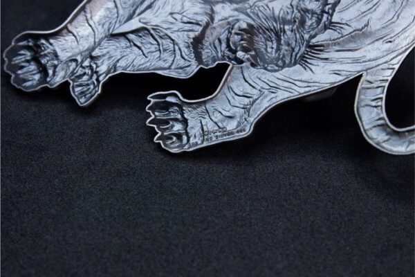 Zoomed image of the 2025 South Korea Tiger 1 oz Silver Antiqued High Relief Shaped Medal showing detailed fur texture, muscle contours, and claw relief on prowling tiger design; background is black to enhance dimensional contrast.