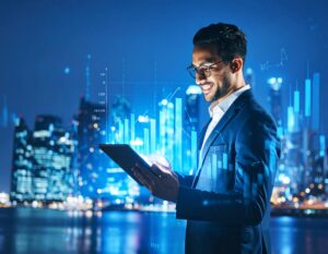 A young professional in a suit looking at a tablet with a city skyline at night in the background, symbolizing smart investment and technology.
