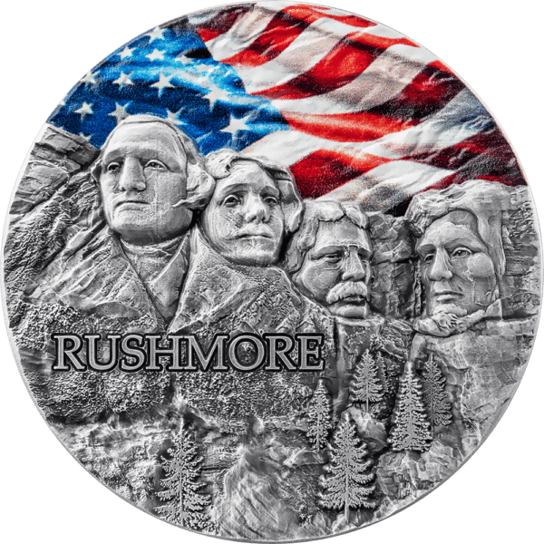 Obverse view of the 2024 Ghana Mount Rushmore Special Edition 2 oz Silver Colorized Coin featuring sculpted faces of Washington, Jefferson, Roosevelt, and Lincoln with American flag in color above; “RUSHMORE” text engraved below.
