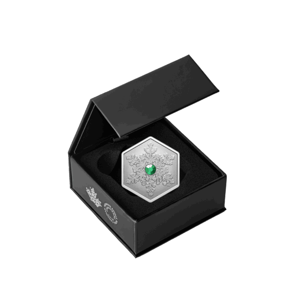 Presentation box containing 2025 Canadian Snowflake 1oz silver reverse proof coin with green crystal insert