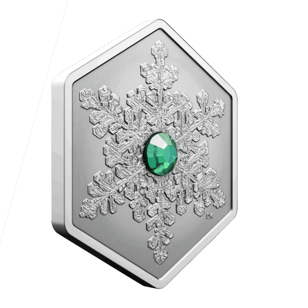Side view of 2025 Canadian Snowflake 1oz silver reverse proof coin with green crystal insert
