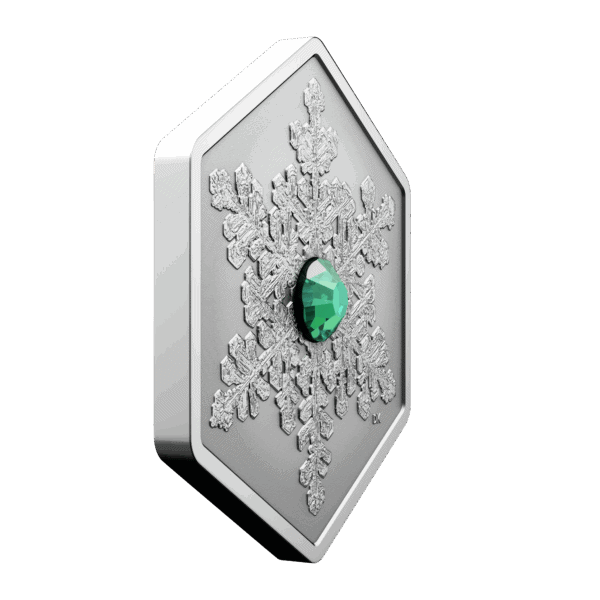 Side angle of 2025 Canadian Snowflake 1oz silver reverse proof coin with green crystal insert