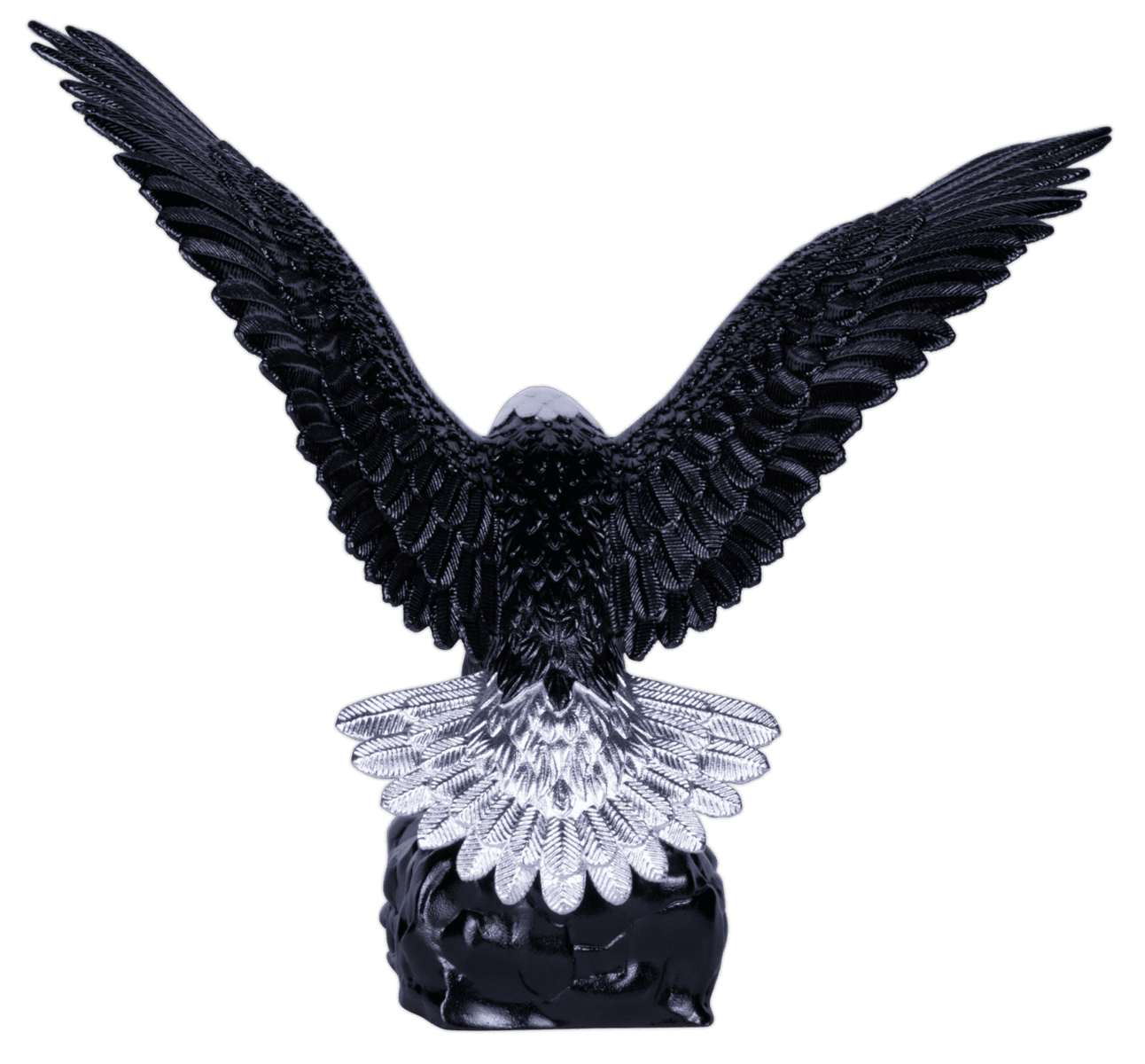 A three-dimensional coin shaped like an eagle, with its wings spread wide in a symmetrical pose. The eagle's body is dark, with silver and colorized details, and its beak and talons are gilded gold. The coin rests on a dark, rocky base.